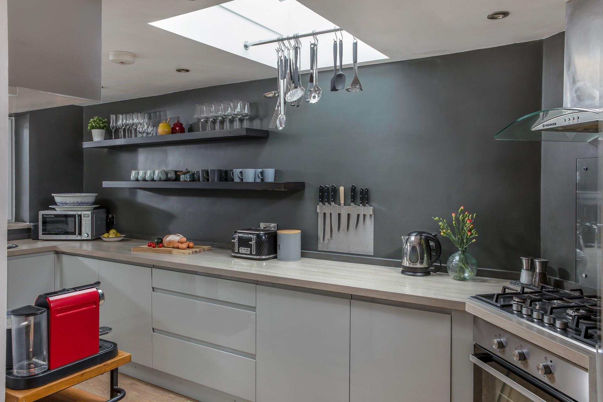 The kitchen is modern and fully equipped for all your culinary needs.