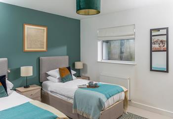 Deep greens and blues make this bedroom a cosy space to unwind each night.