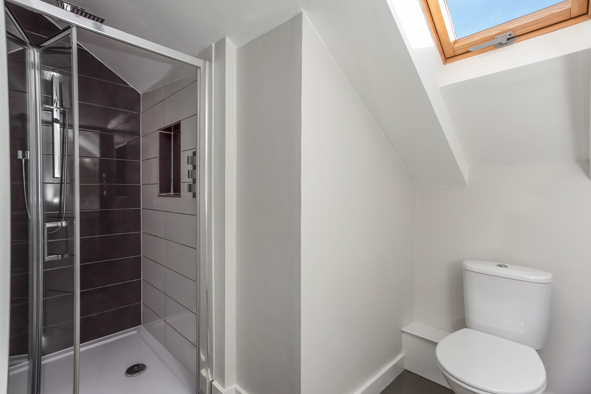 Wash off sandy toes in the shower after a day on the beach.