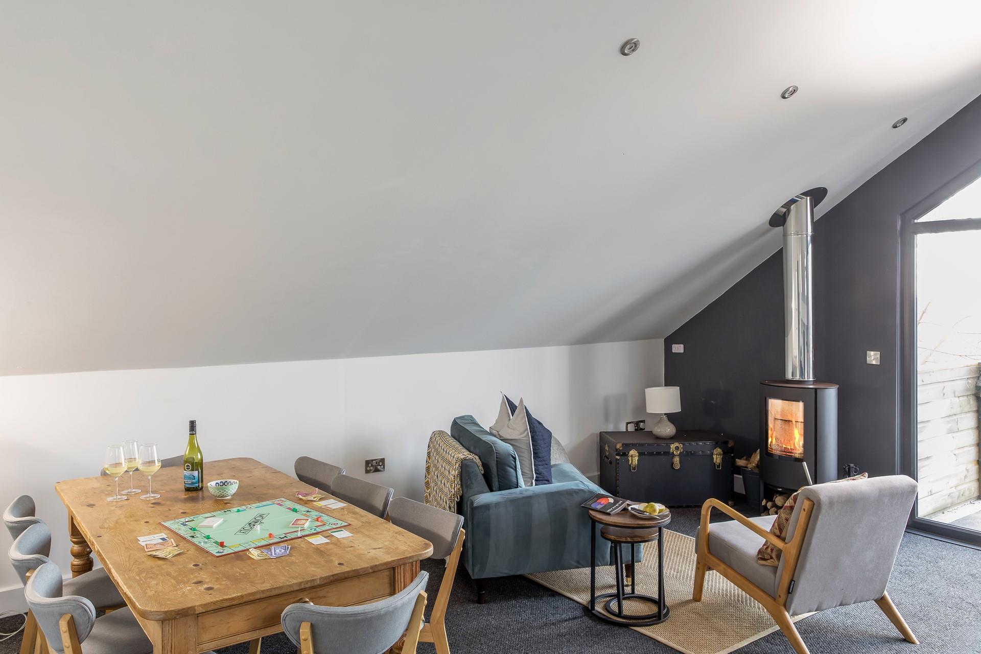 Enjoy a family game night in the stylish sitting room after a day on the beach.