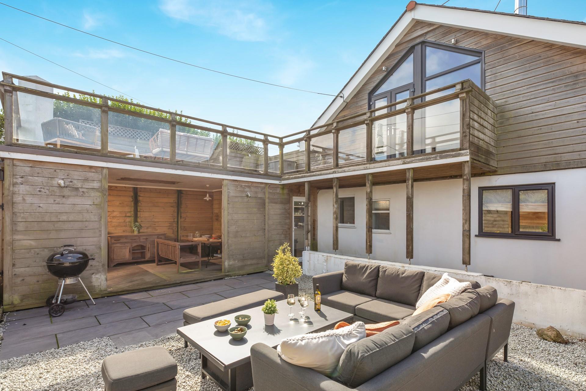 There is seating outside for the whole family, and your furry friend will love the garden area.