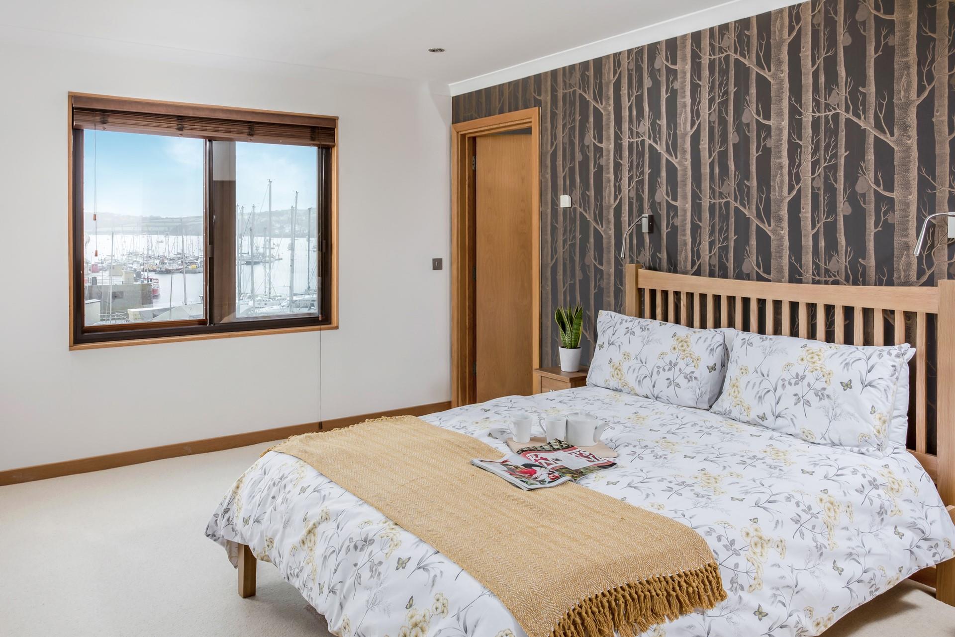 Laze in bed watching the boats bobbing on the ocean.