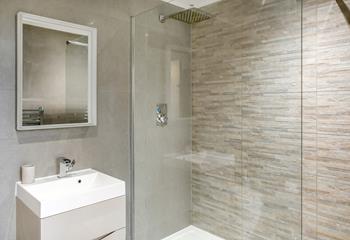 The rainfall shower offers a luxury touch to the en suite shower room.