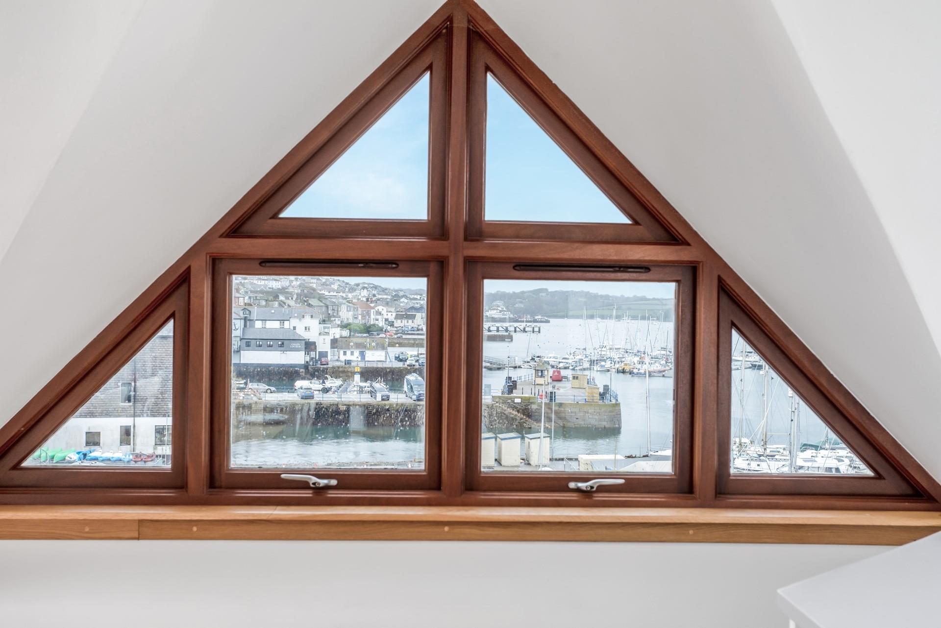 Climb the spiral staircase to the mezzanine and gaze across the quayside.