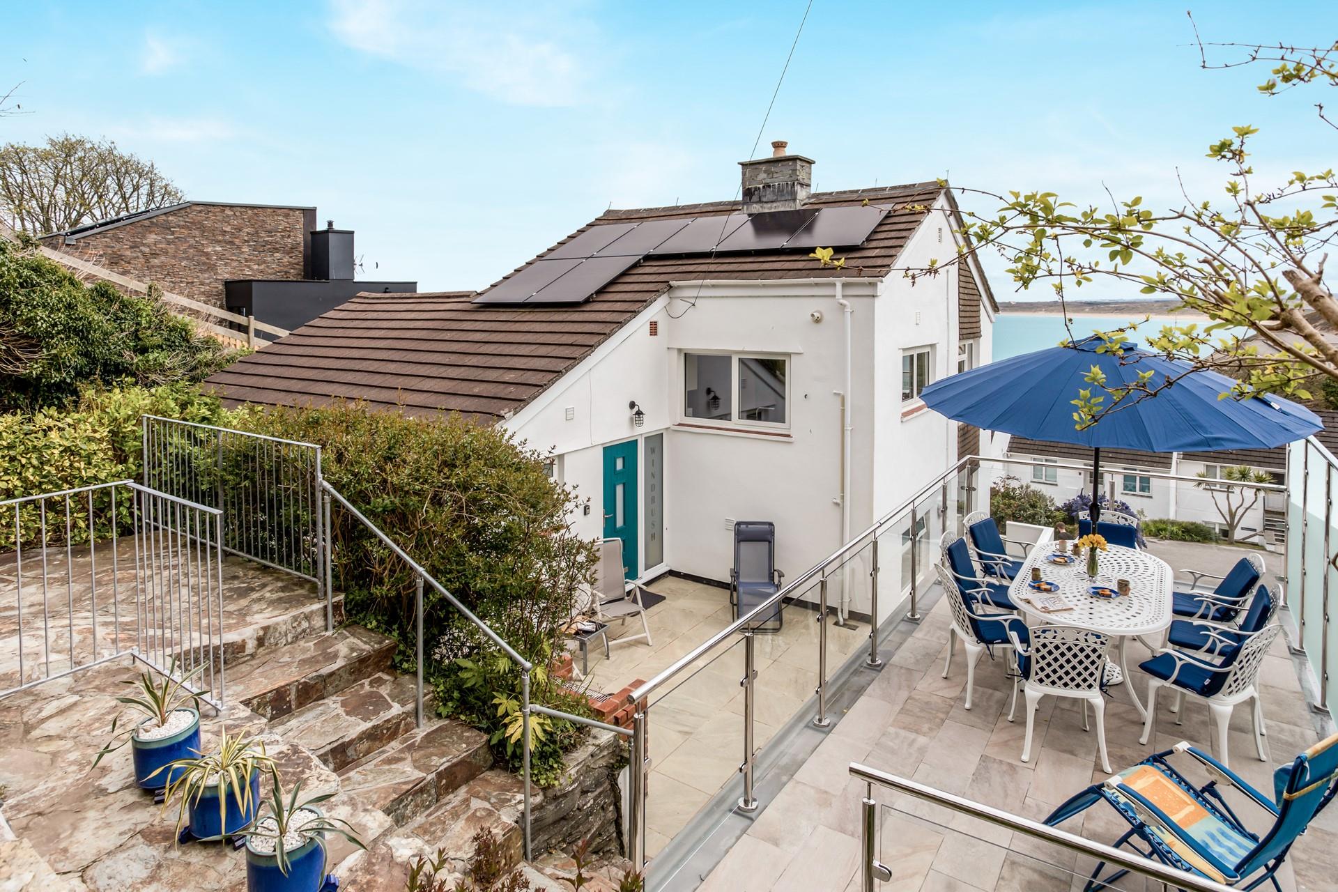 Unwind in the garden, dining under a Cornish sky.