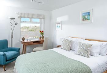 Bedroom 4 has a spacious king size bed and beautiful sea views.