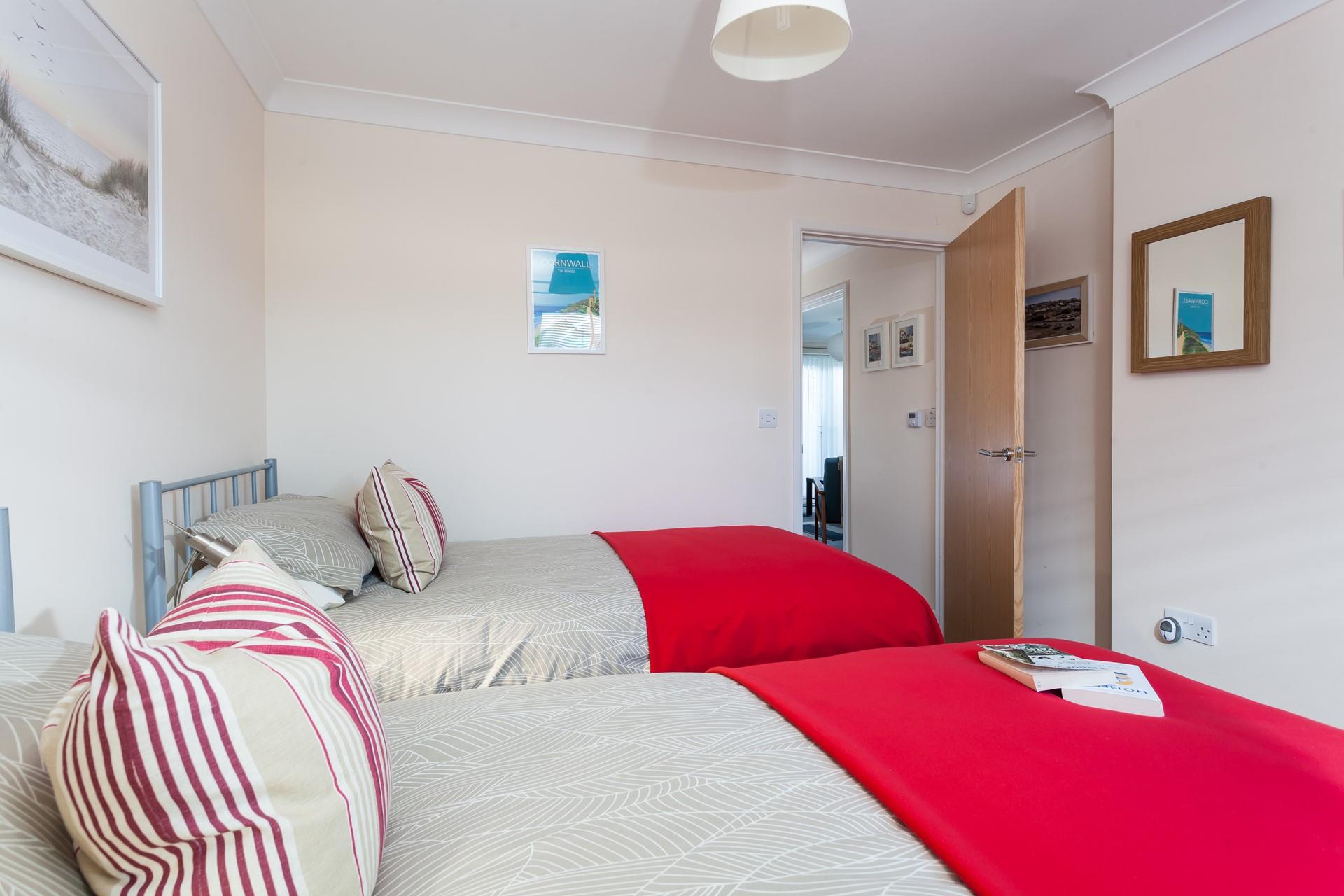 Cosy and light, bedroom 2 is perfect for relaxing after a long day of exploring.