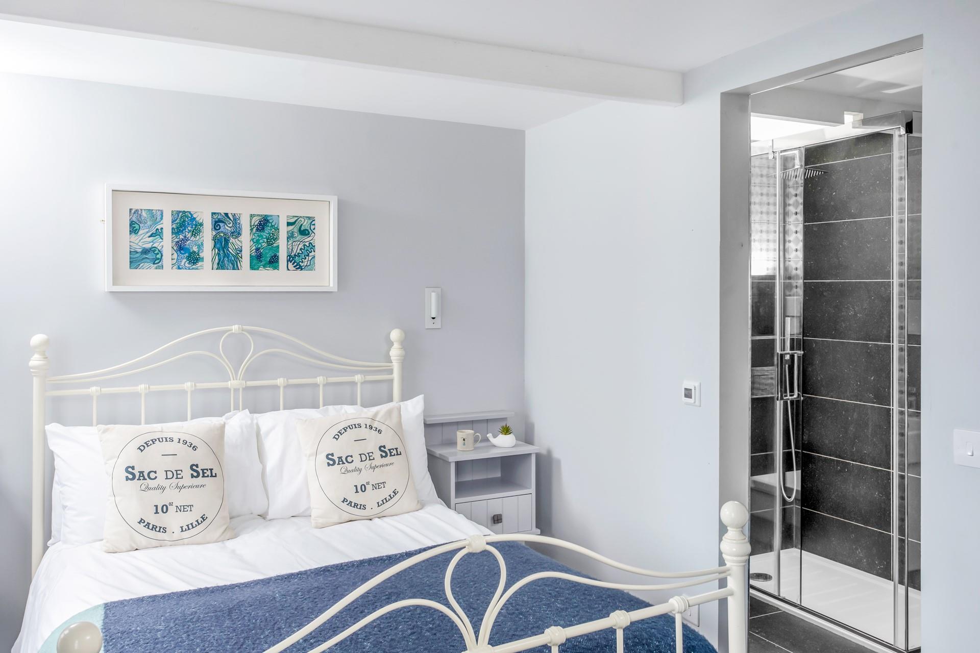 Wash off the sand from a day on the beach and tuck into the soft sheets of the king size bed.