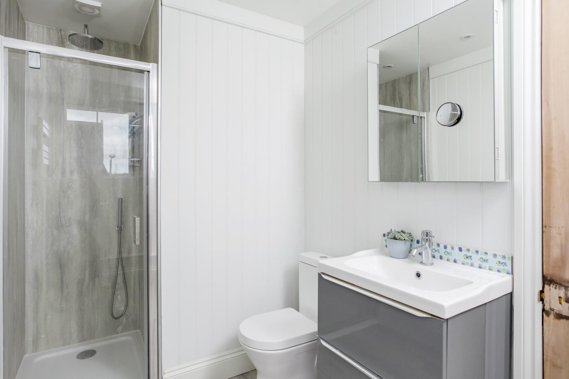Wash off sandy toes in the rainfall shower after a day spent on Gylly beach.
