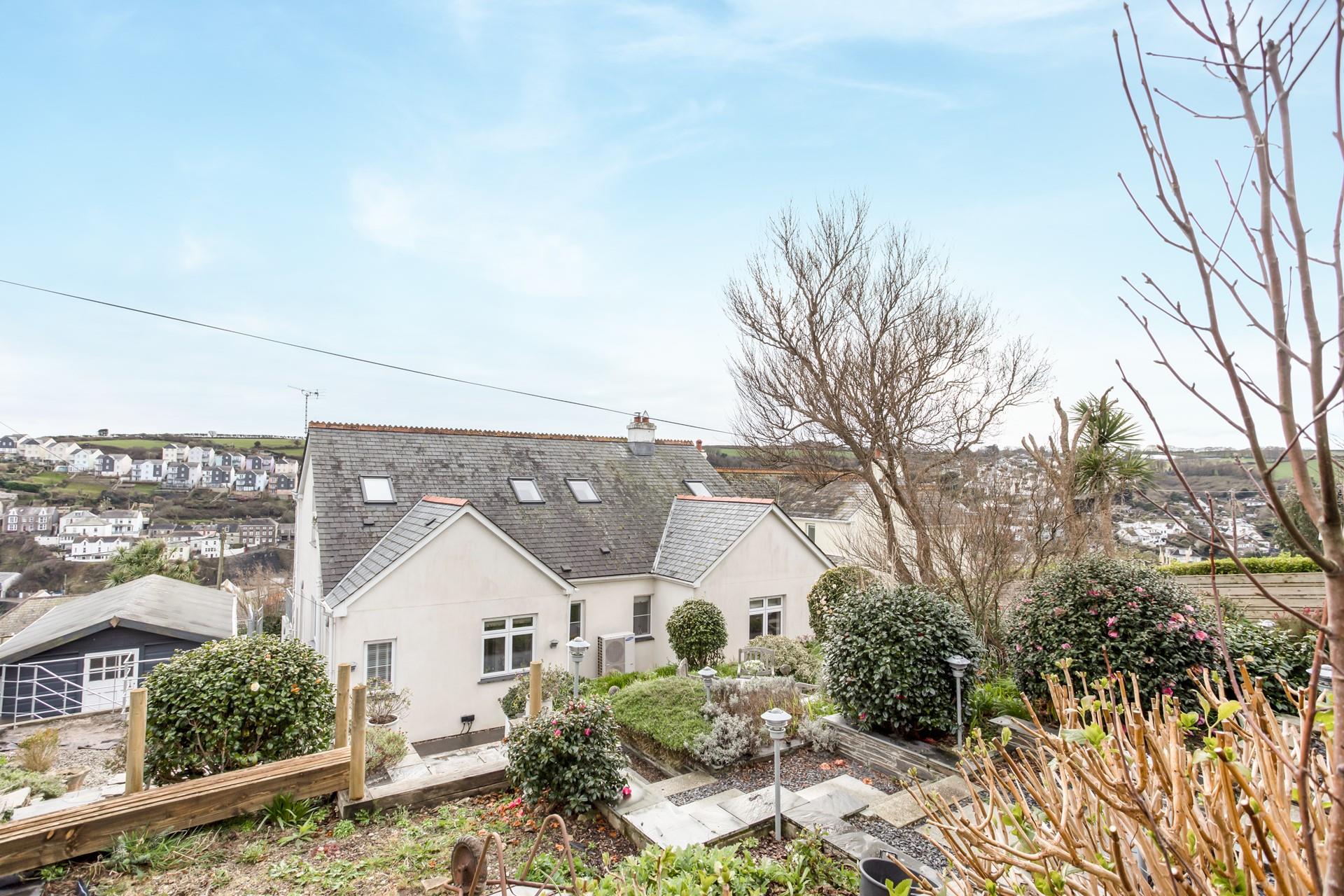 The large garden is perfect for enjoying al fresco dining.