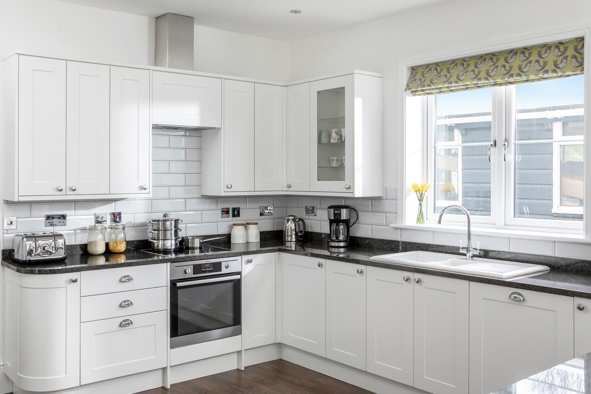 The modern and well-equipped kitchen is perfect for cooking up a storm.