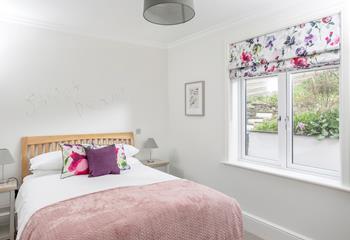 Snuggle into bed in the bright and colourful room for a relaxing night's sleep.