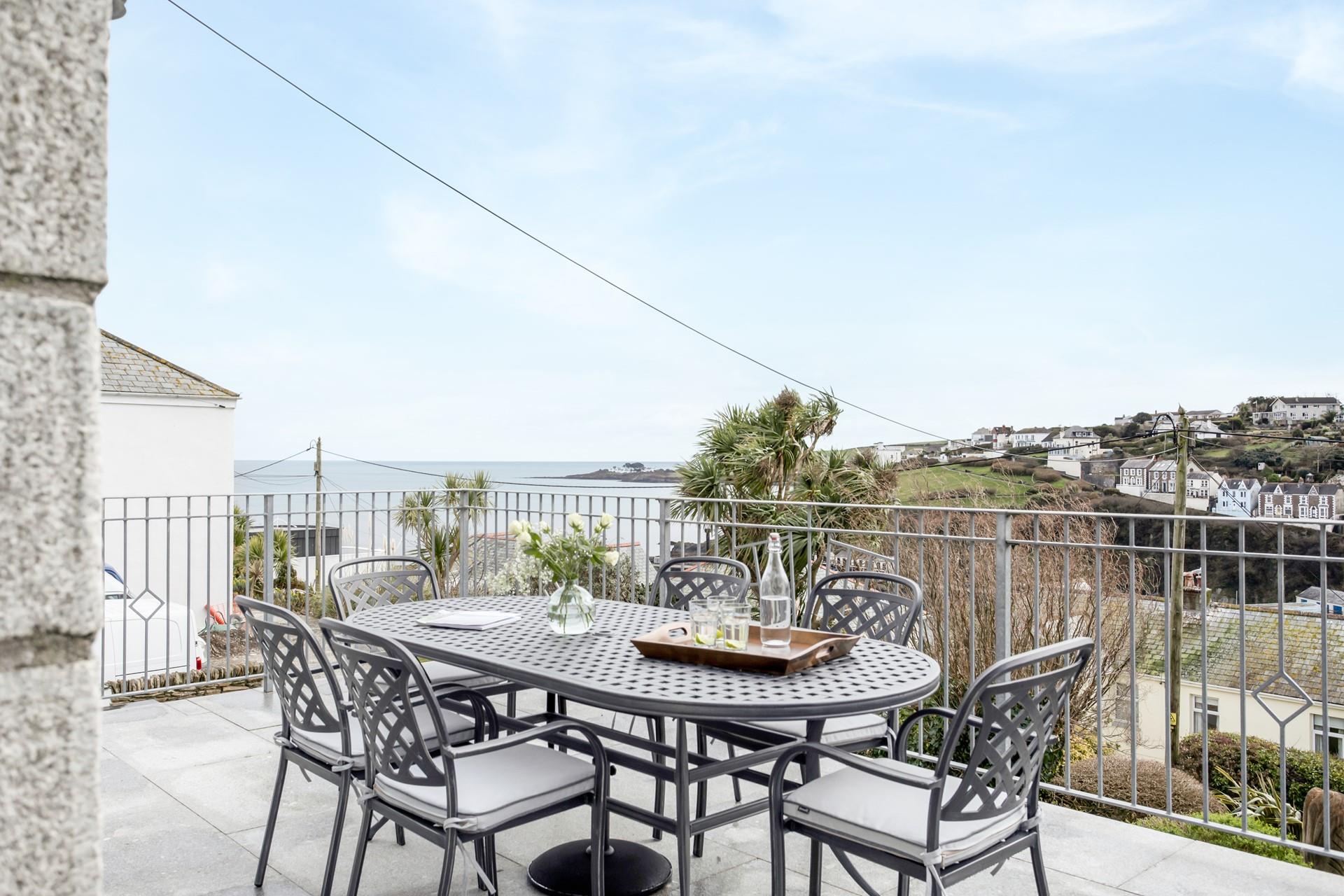 The balcony is the perfect spot for al fresco dining in the summer sunshine.