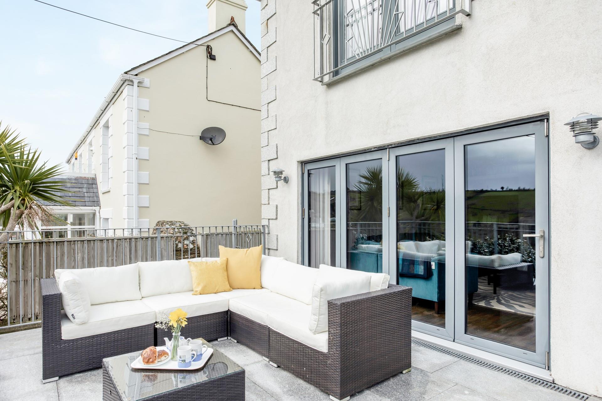 Unwind on the relaxing rattan furniture in the afternoon sunshine.