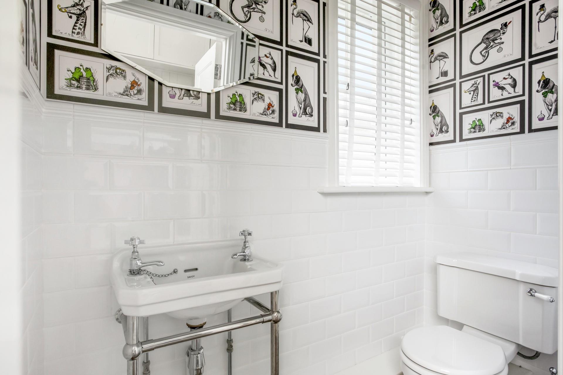 We love the quirky wall art in the cloakroom!