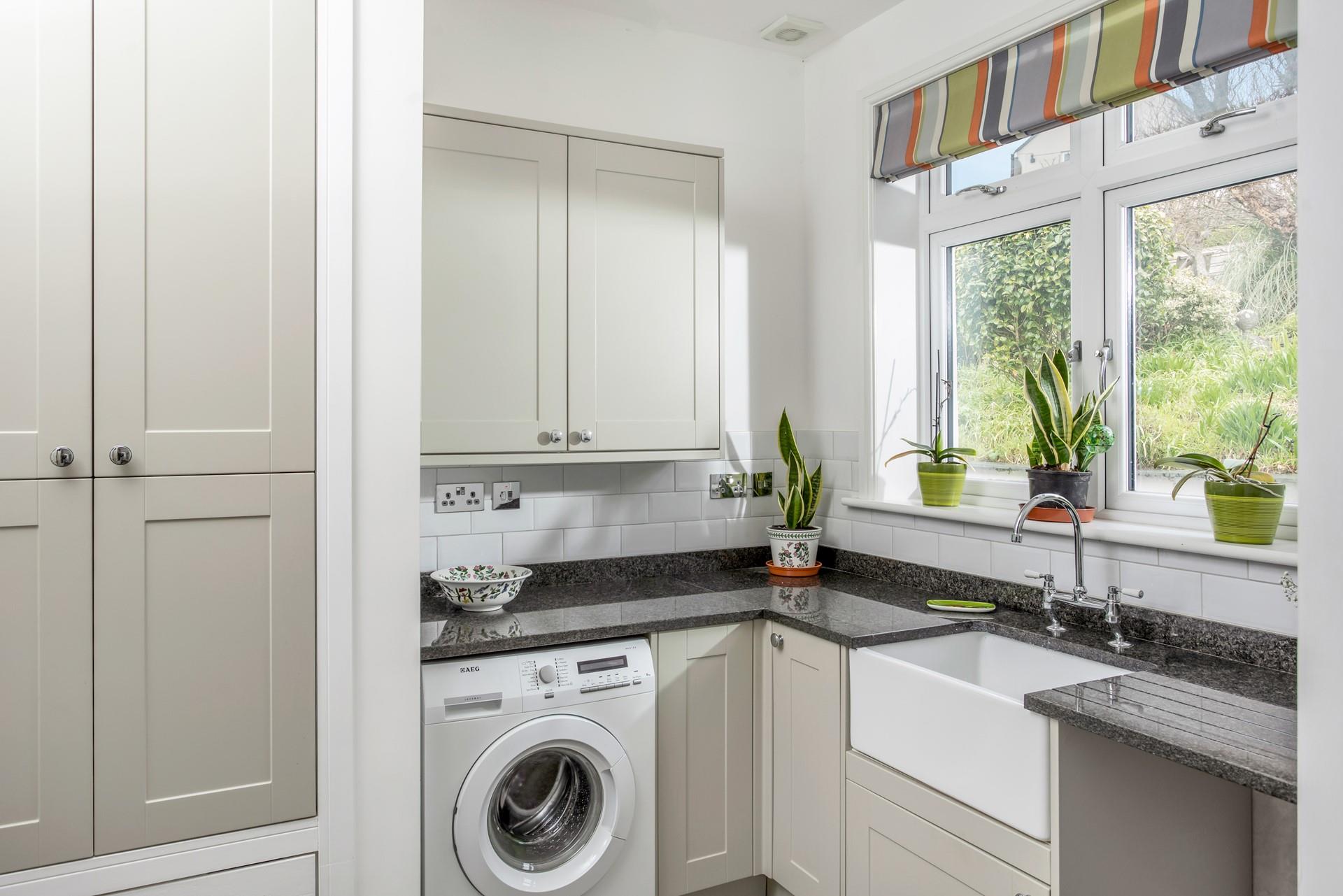 The utility room has an additional sink and washing machine.