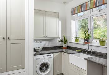 The utility room has an additional sink and washing machine.