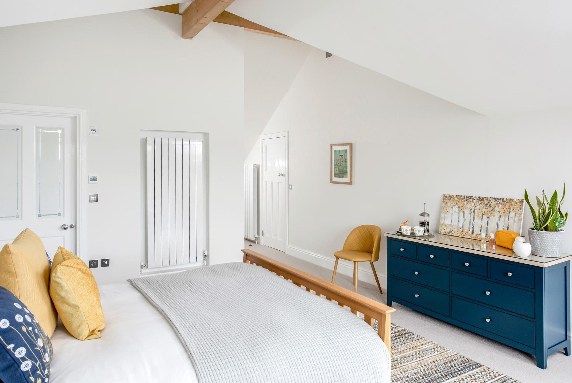 The bedroom is light and airy, the perfect space to get ready for the day.