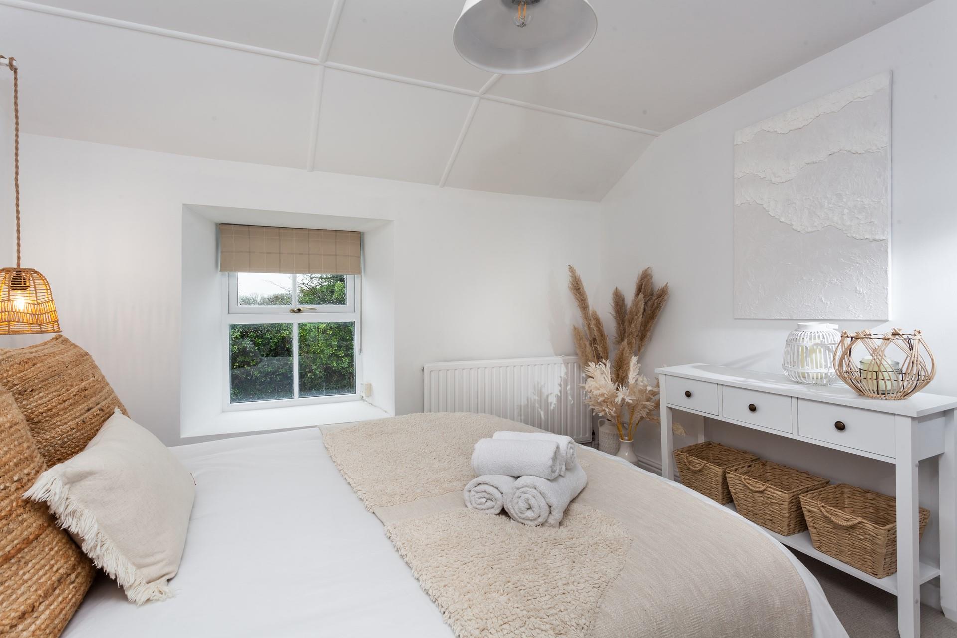 Soft sheets and fluffy towels await you in bedroom 1.