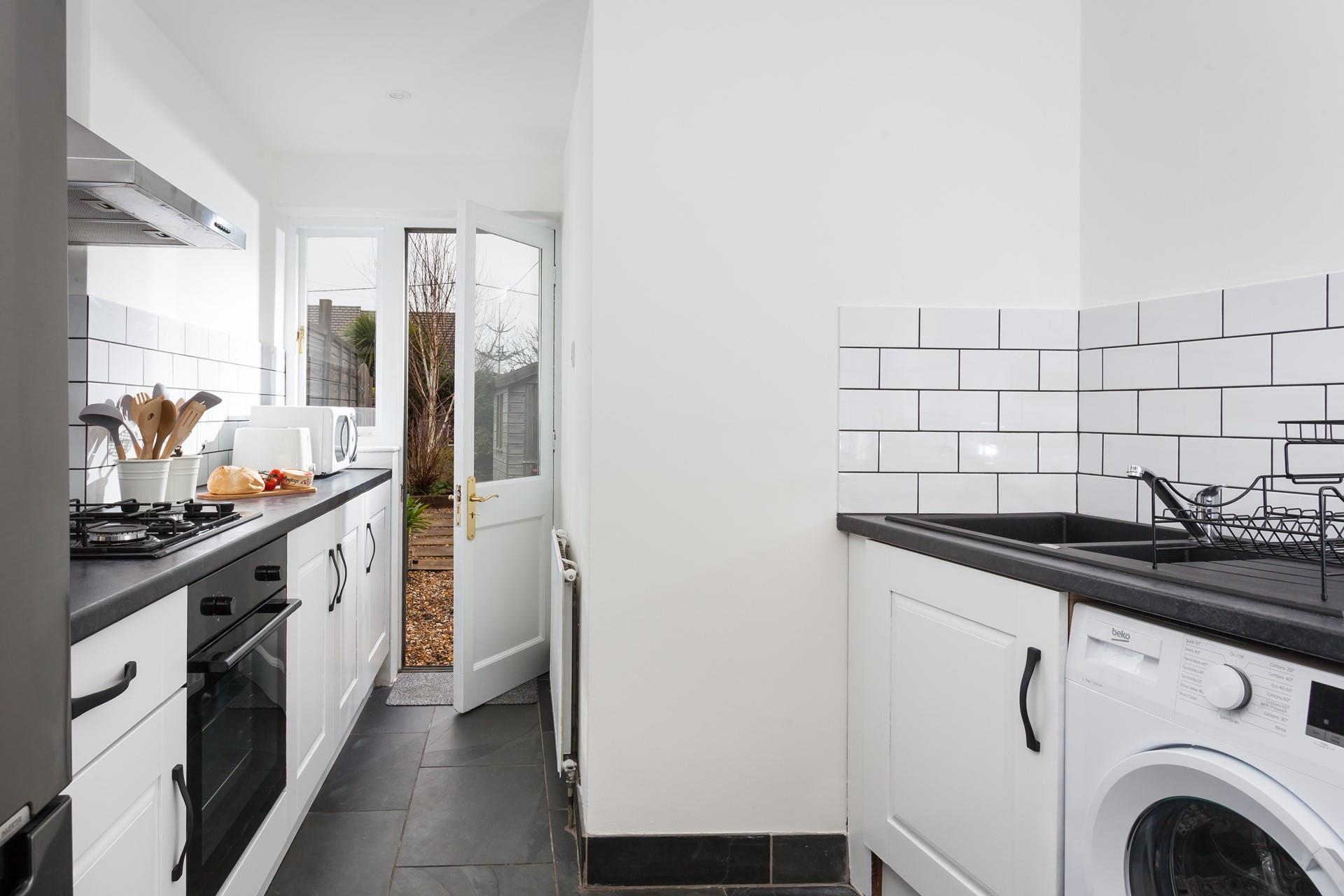 The kitchen has a door to the outside area so you can take your meals al fresco.