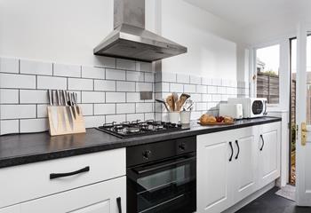 The stylish kitchen is fully equipped for cooking tasty meals.