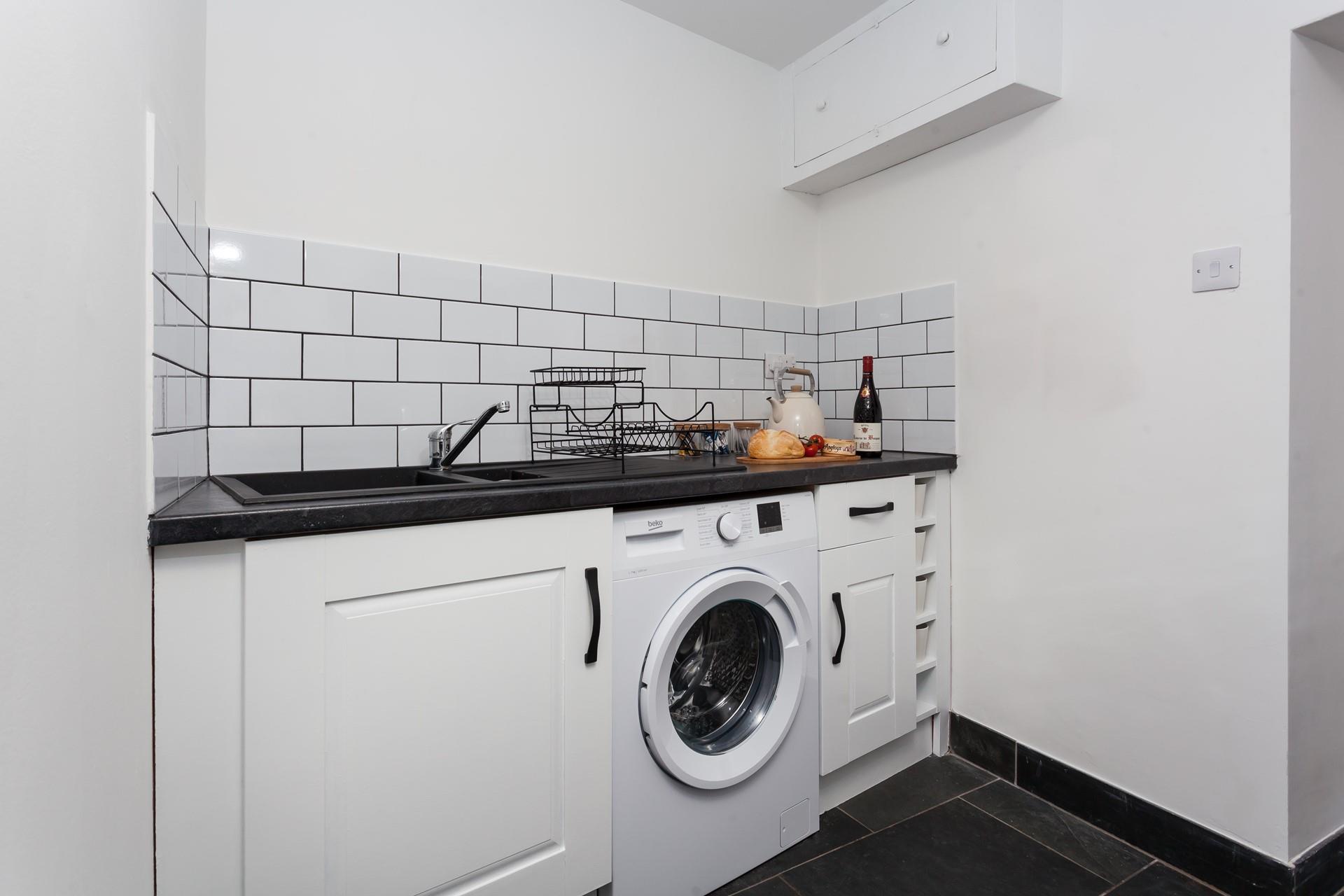 There is a washing machine included in the cottage.