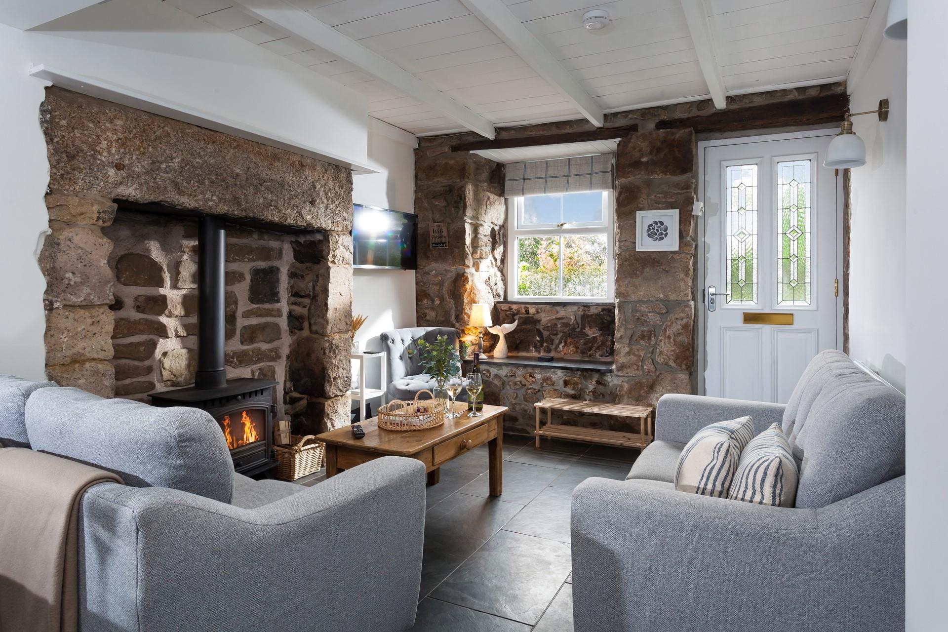 Sink into the sumptuous sofa and cosy up in front of the woodburner on a winter's afternoon.