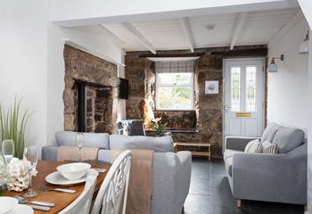 The open plan living area is cosy and full of cottage charm, perfect for spending quality time together.