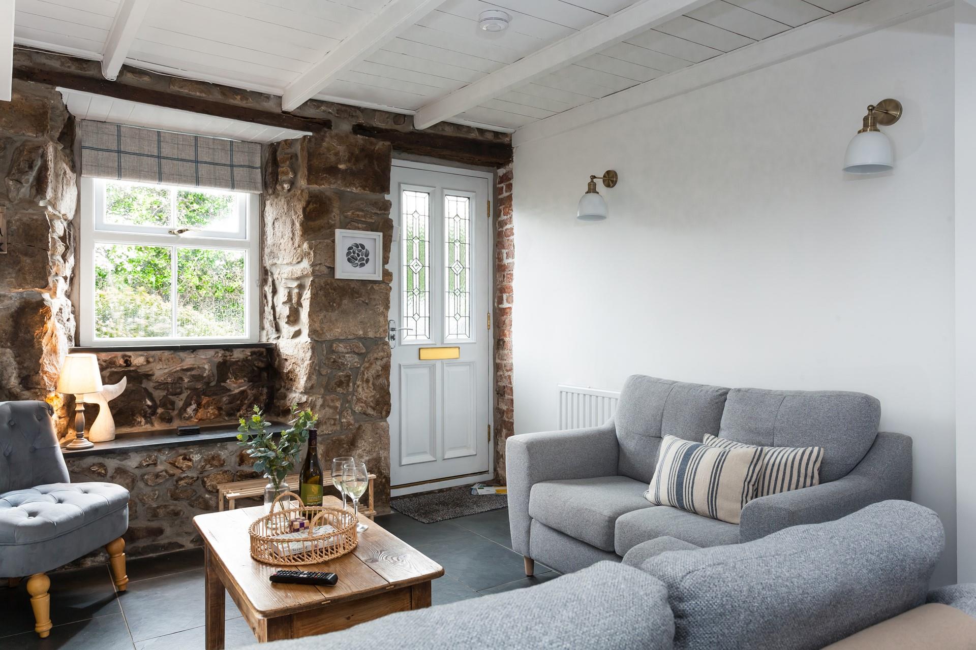 Snuggle up with your loved ones after taking a stroll across Porthkidney beach.