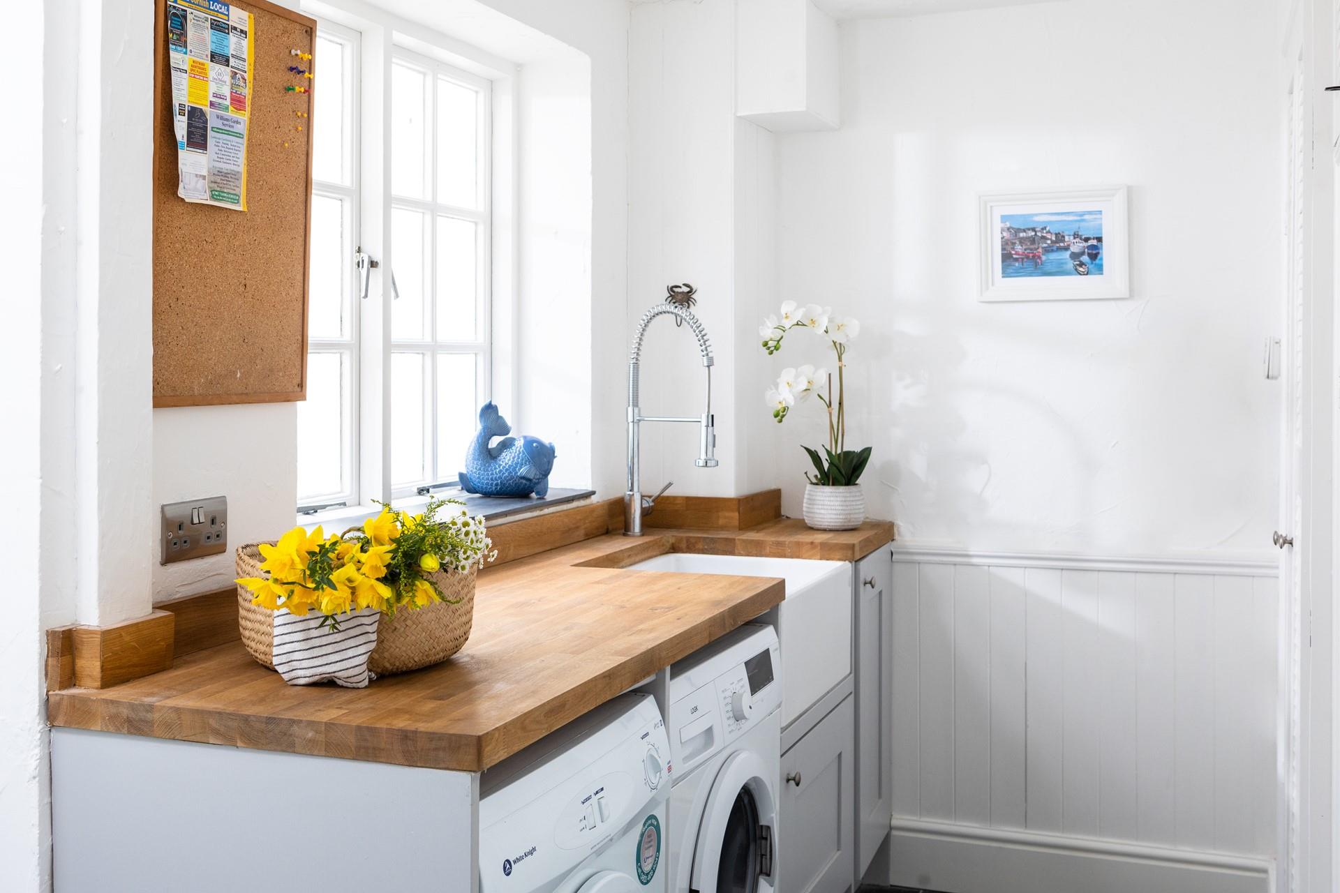The utility room has a useful washer and a dryer.