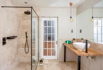 Start the day with an invigorating morning shower in the stylish garden.