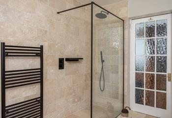 Warm fluffy towels taken straight from the heated towel rail are a dream after a luxurious rainfall shower.