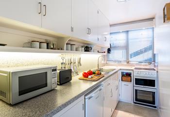 The kitchen is fully equipped to prepare and cook tasty meals.