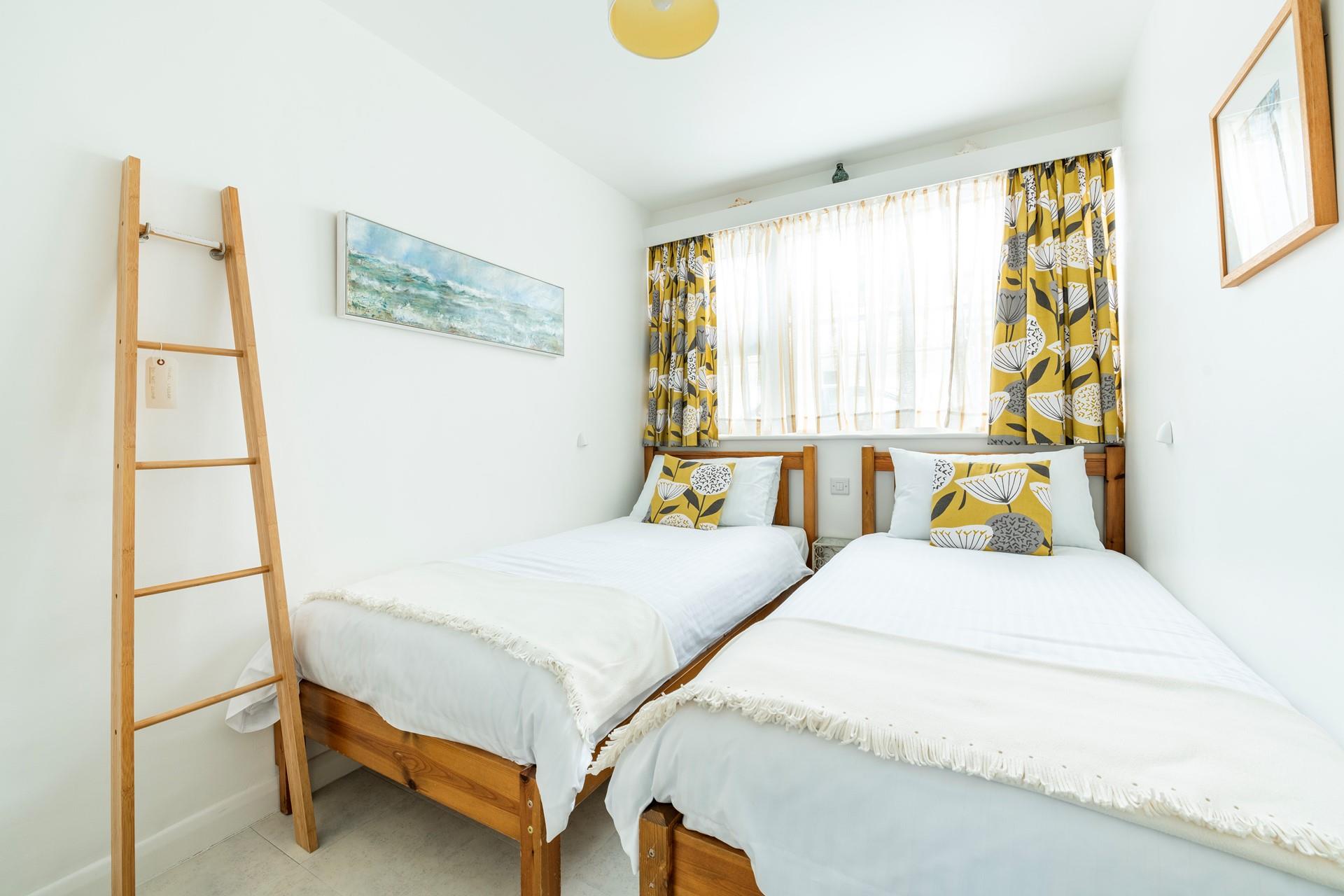 The twin beds are perfect for adults or children to tuck into each night.