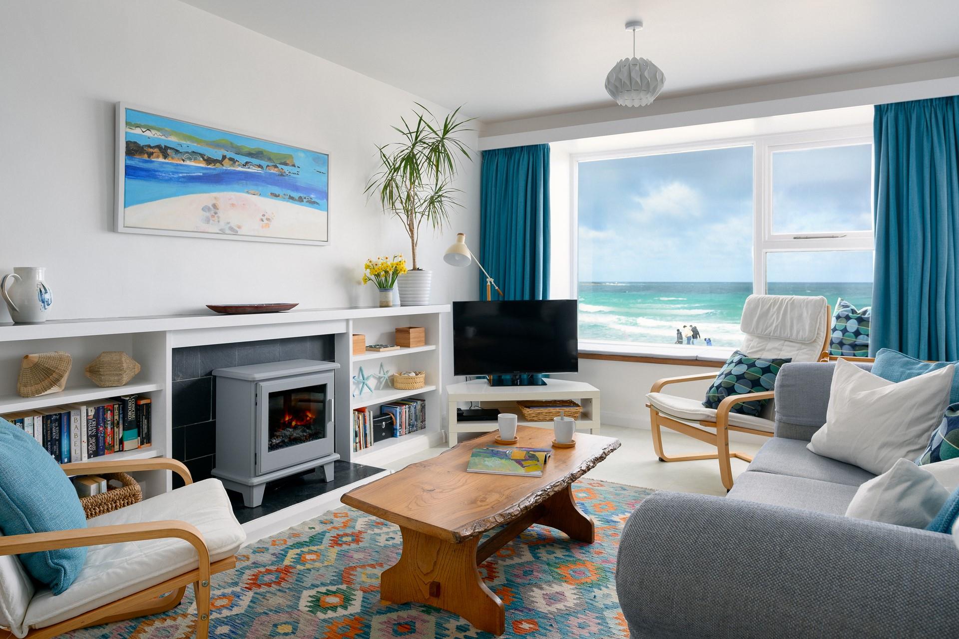 Sit and enjoy the waves rolling onto shore, you don't even need to leave the apartment with those views!
