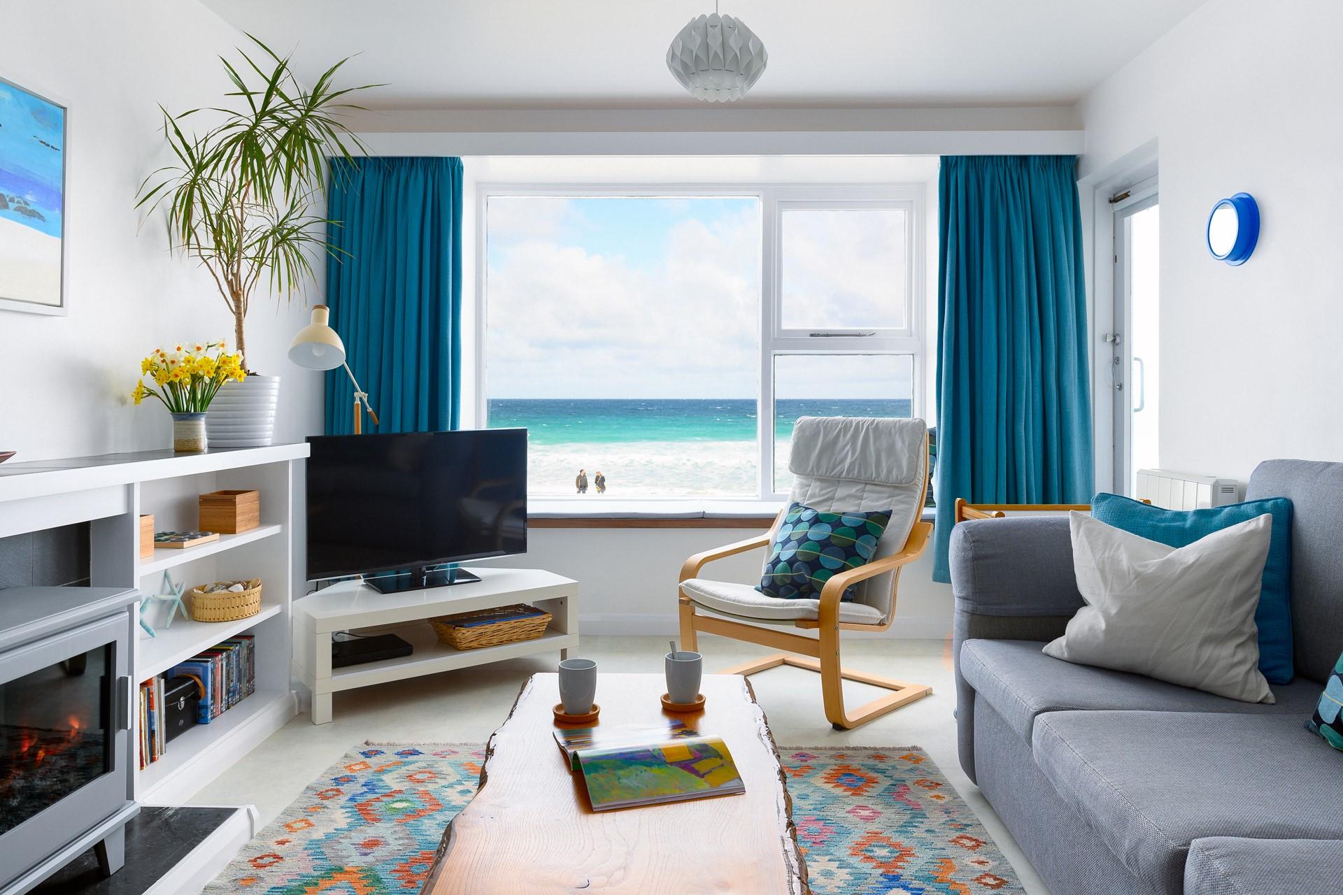 Sip your favourite drink as the sun comes down over the sea.