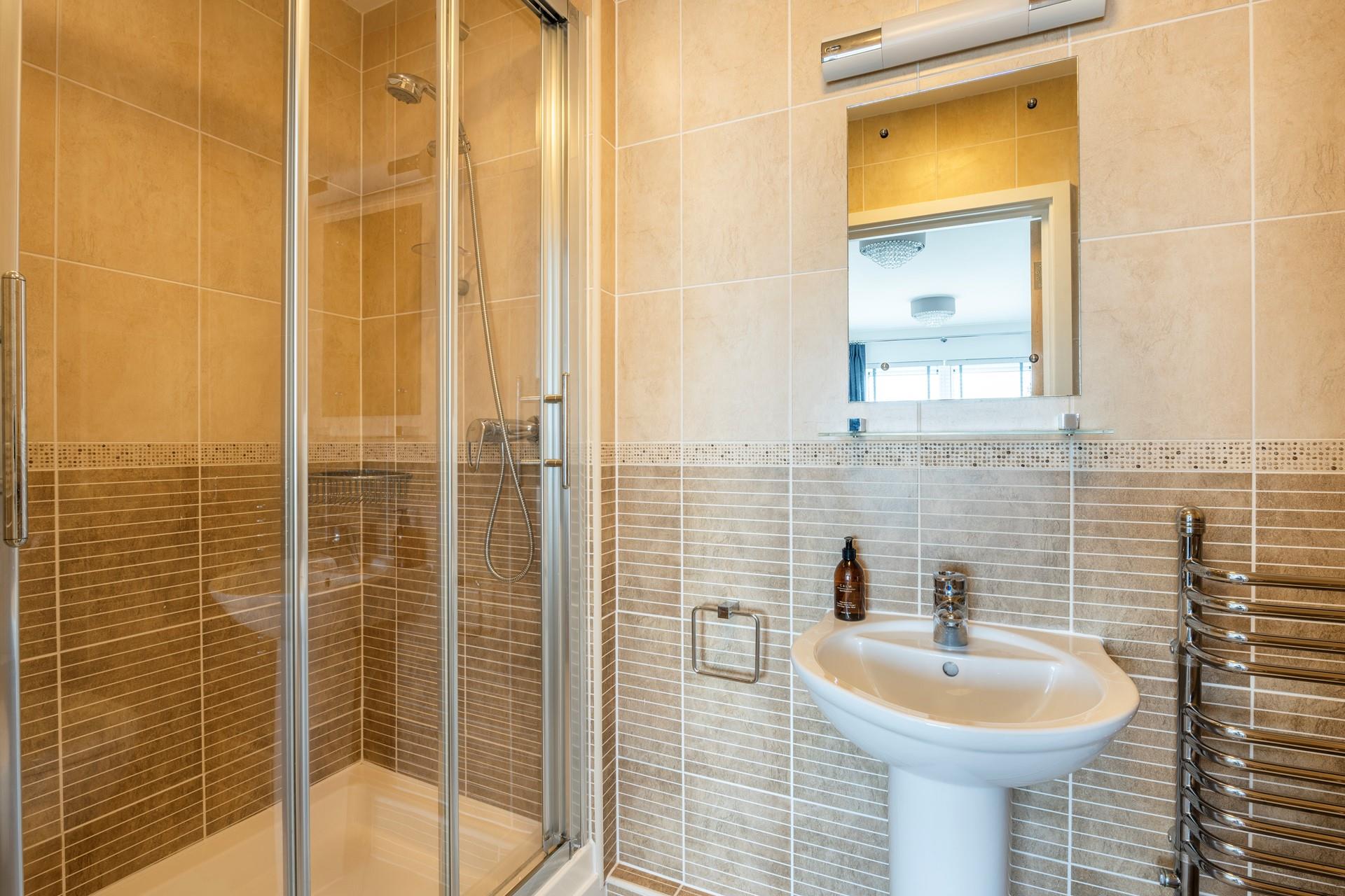 Wash off sandy toes in the shower after a day on the beach.