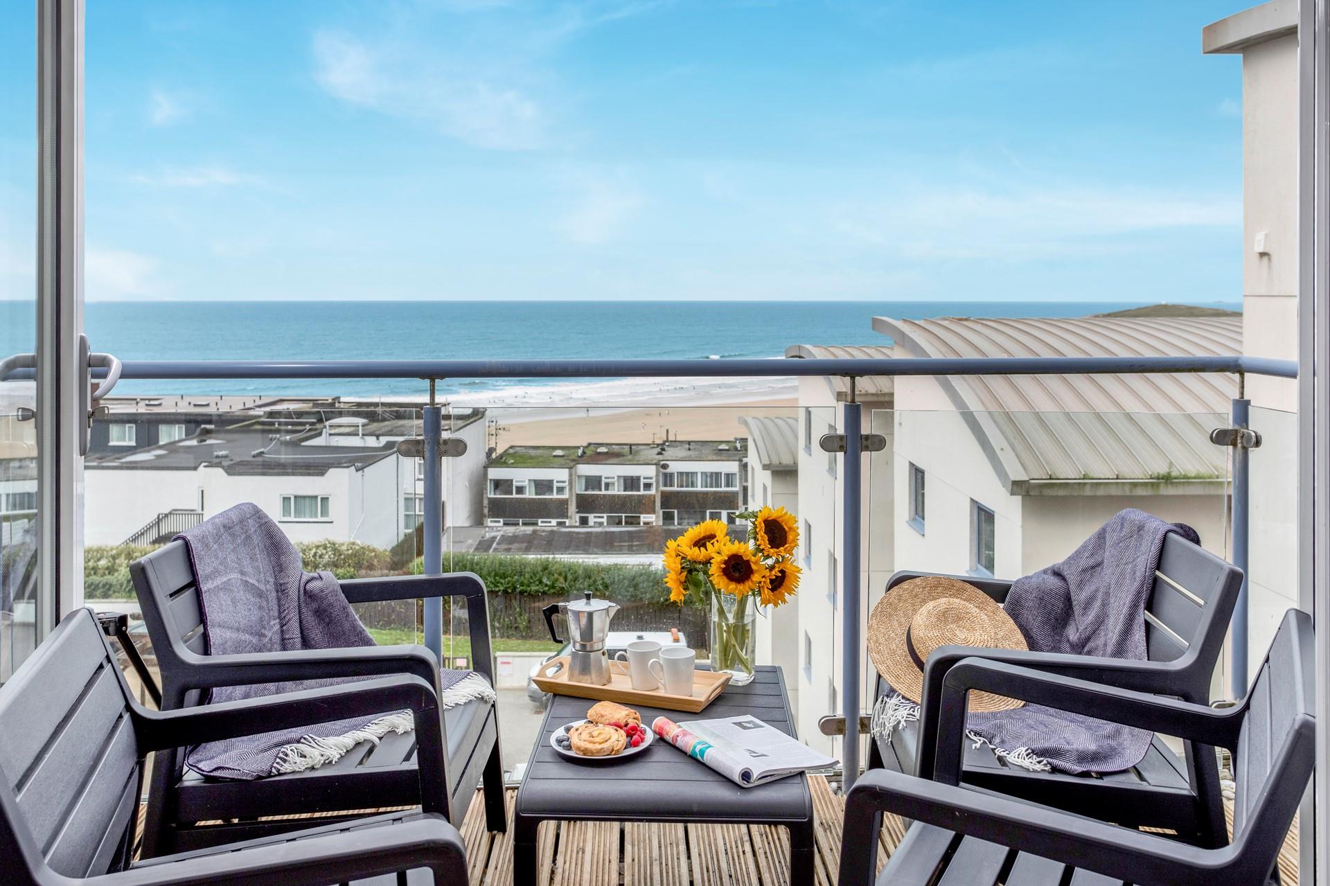 Soak up the sun on the balcony, watching surfers take to the waves.