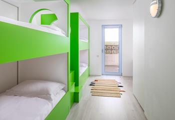 Colourful and contemporary bunk beds will delight the little ones.
