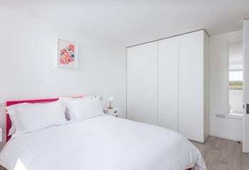 Touches of pink in the master bedroom.