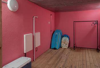 This handy area is great for storing wetsuits and boards!