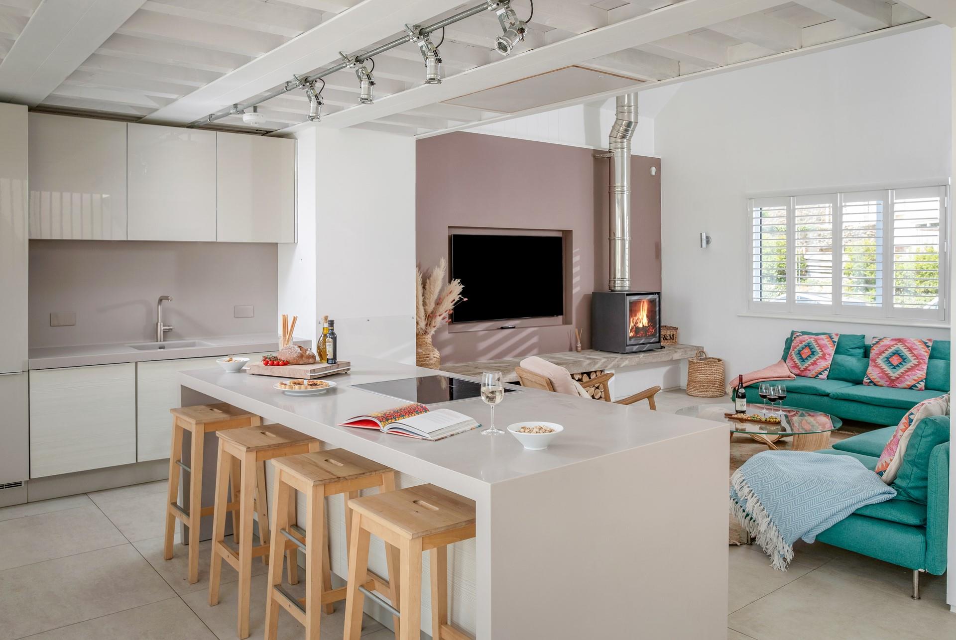 The sleek woodburner is a cosy addition on chillier evenings.