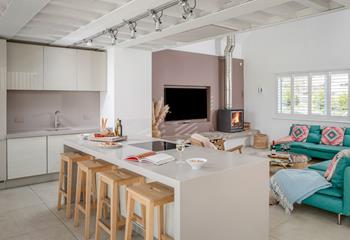 The sleek woodburner is a cosy addition on chillier evenings.