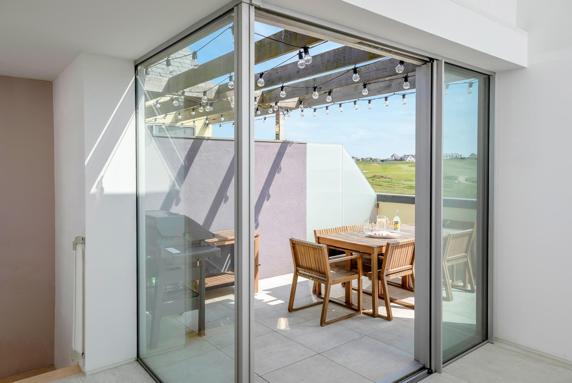 The balcony is ideal for enjoying al fresco meals.