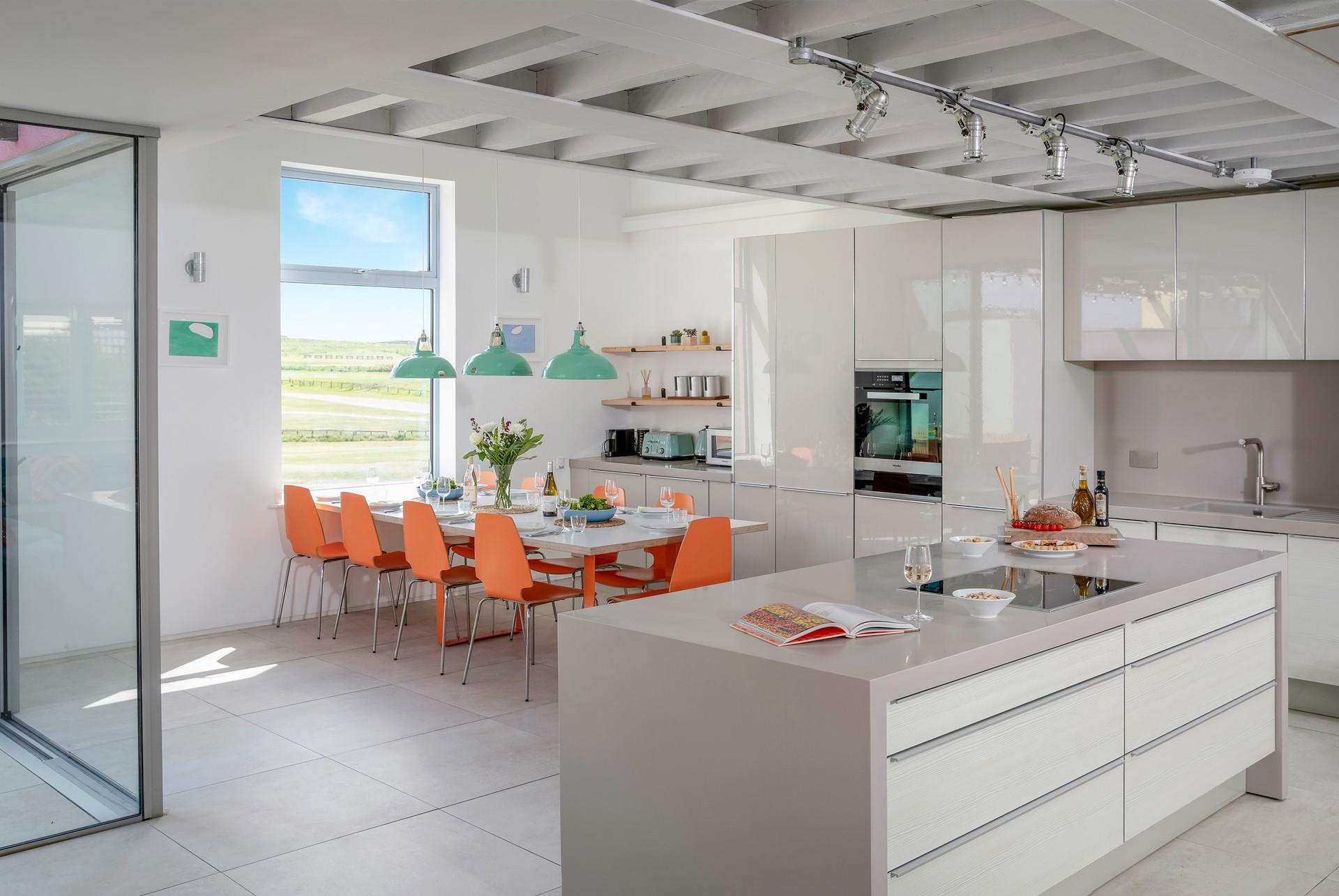 The kitchen is modern and sleek.