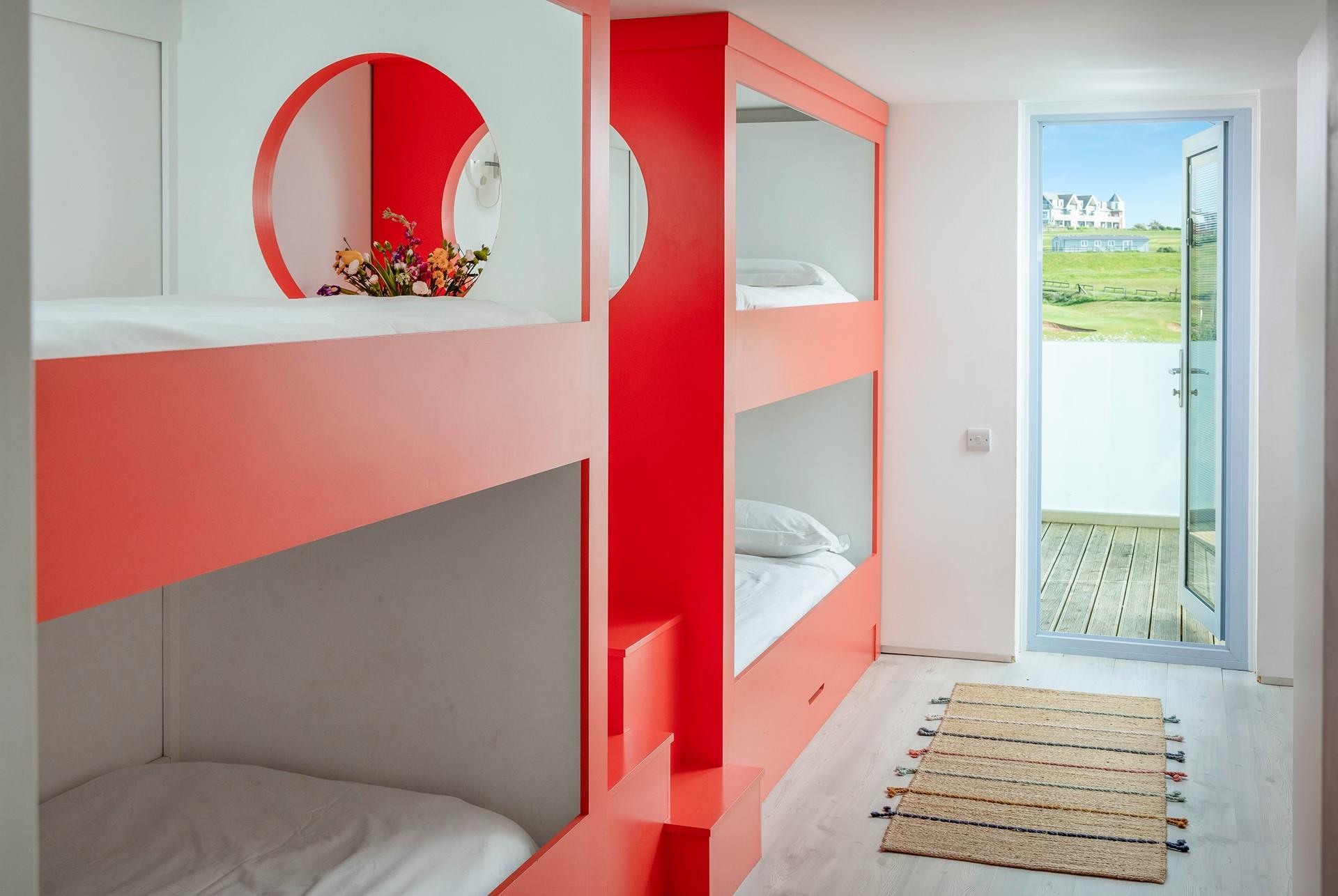 Colourful and contemporary bunk beds will delight the little ones.