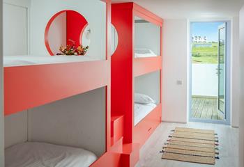 Colourful and contemporary bunk beds will delight the little ones.