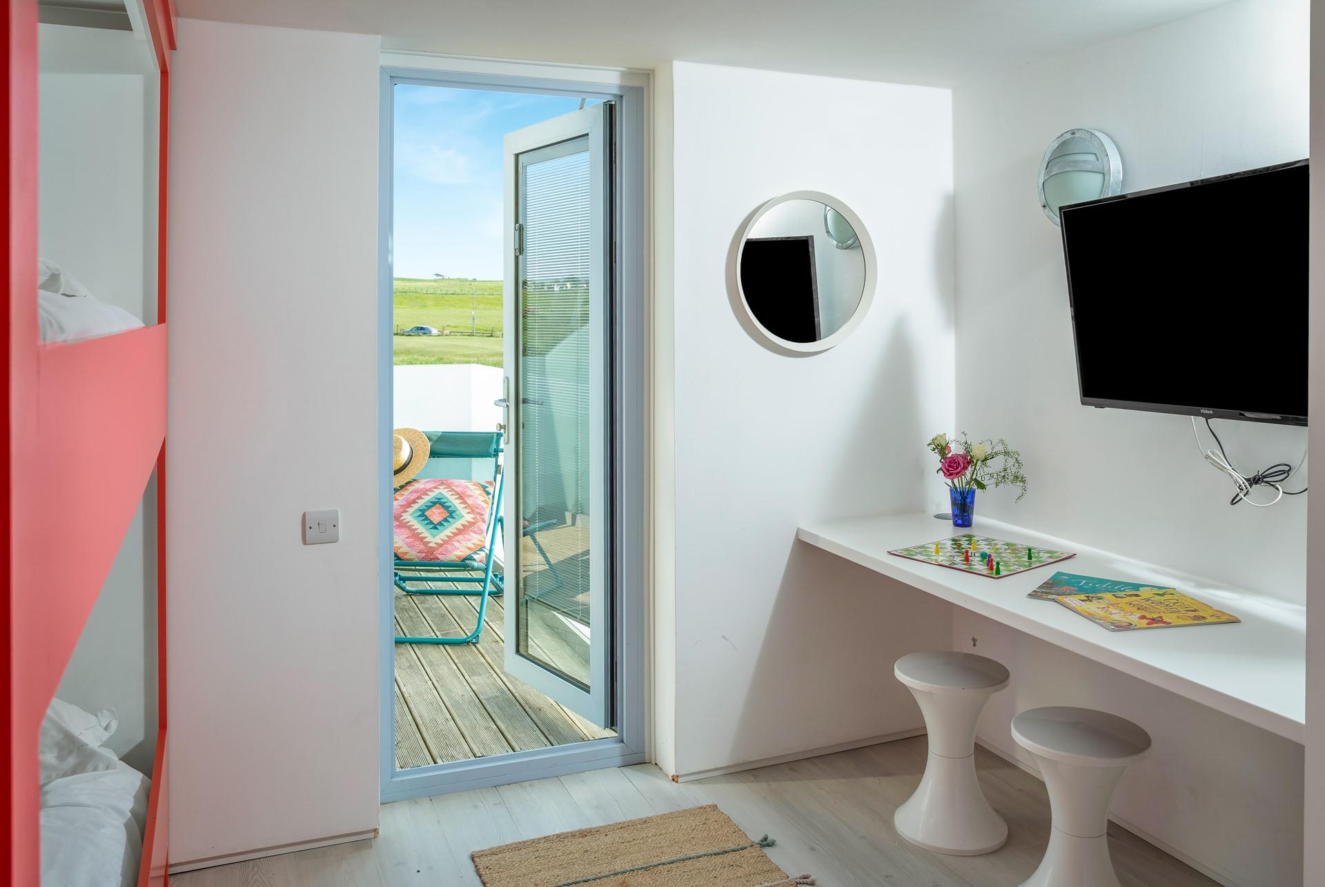 Let the warm summer breeze in from the balcony.