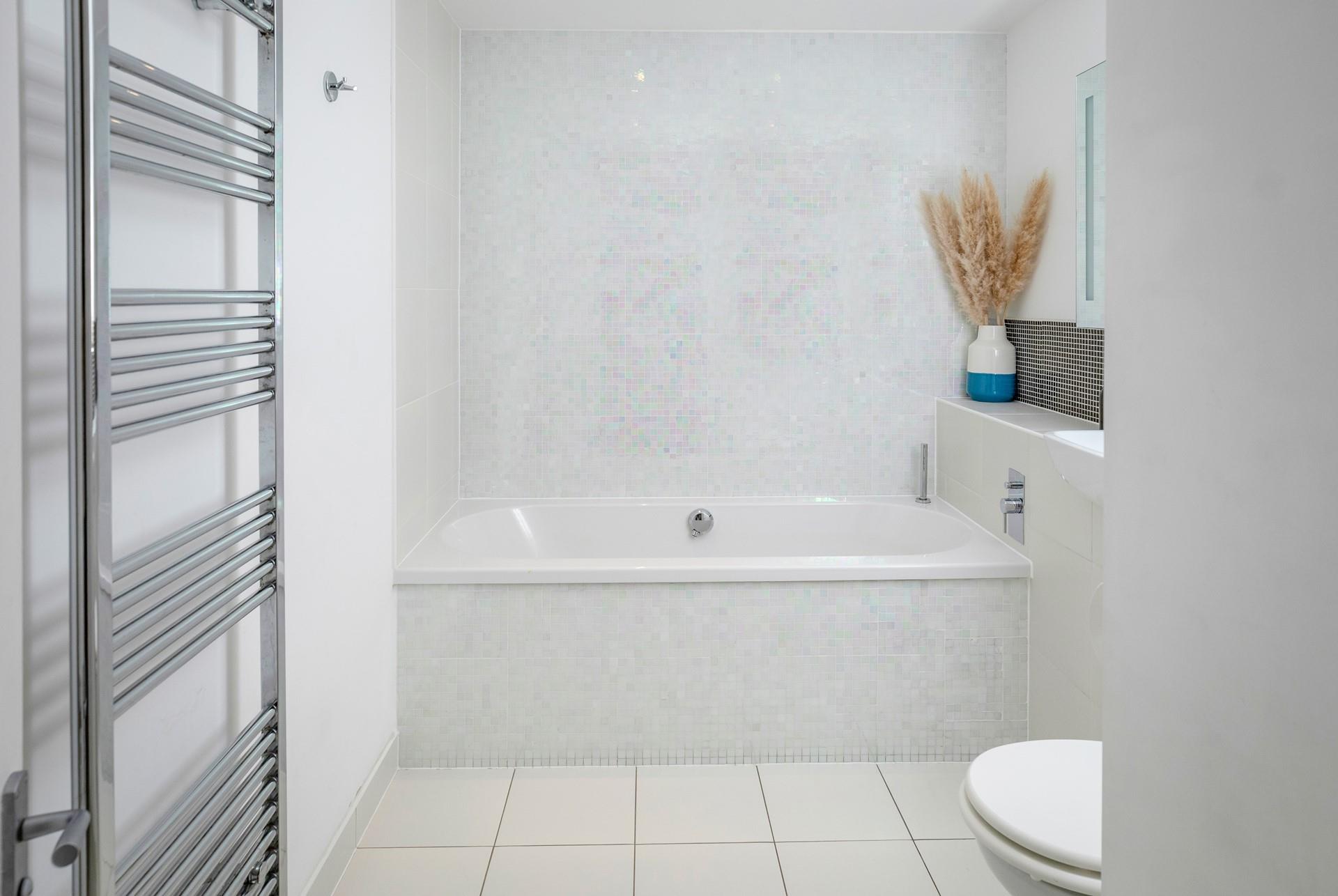 Slip into a rejuvenating bubble bath after a day on the beach.