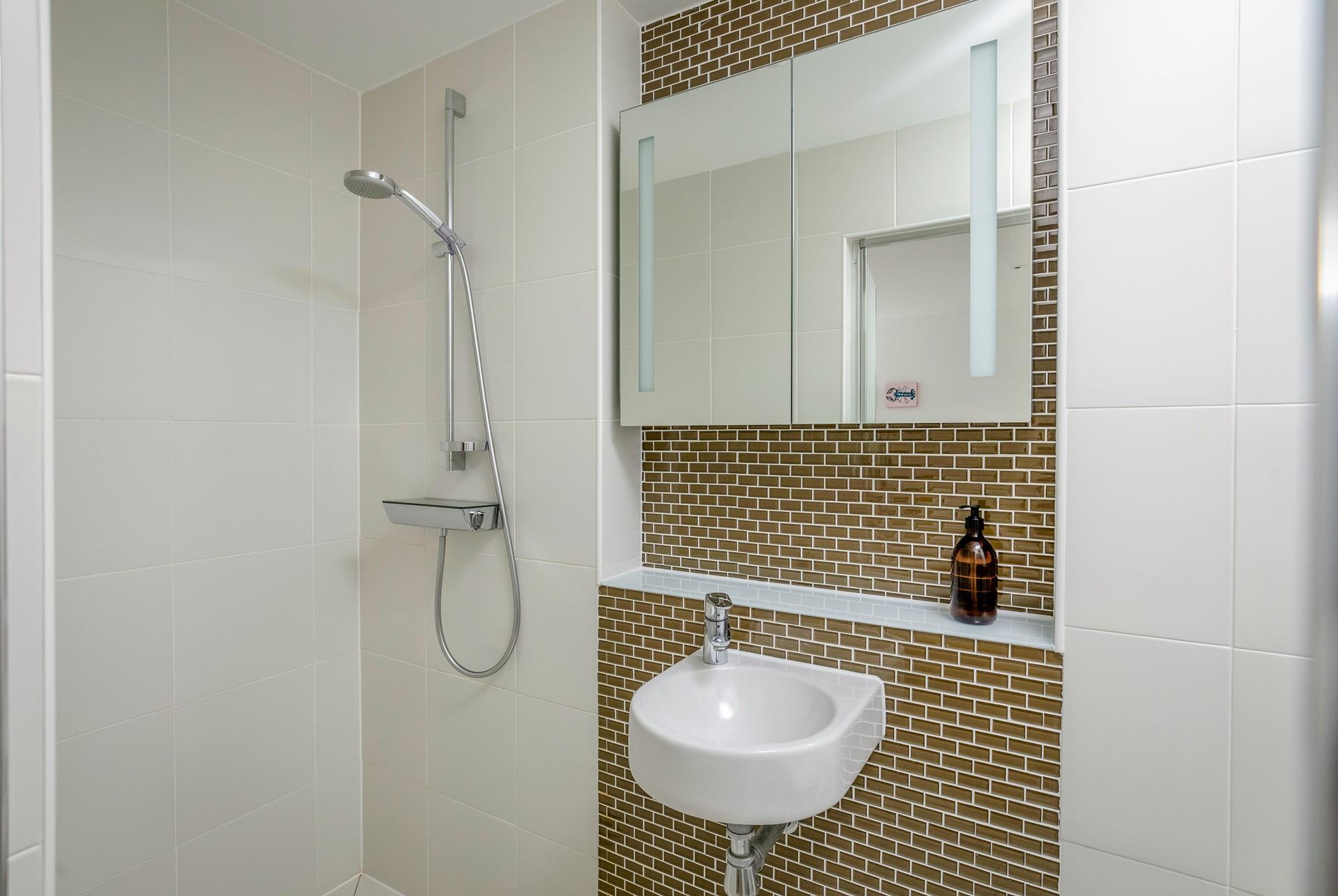 Get ready for the day in the stylish shower room.